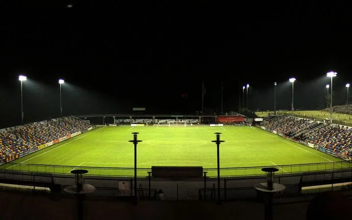A floodlit sports field at night