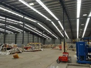 Warehouse interior lit by LED high bays