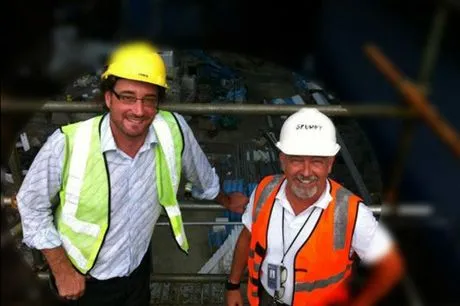 Kevin Day and Cam Crossley in hard hats and hi-vis on site