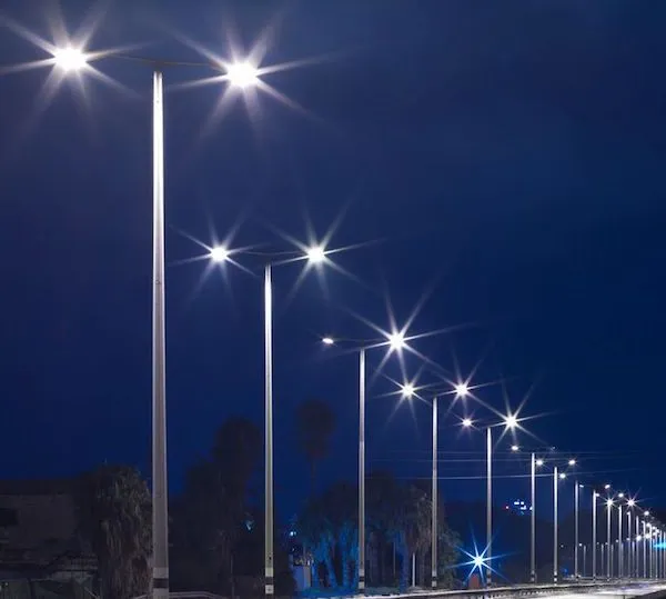 LED street lights along a road at dusk