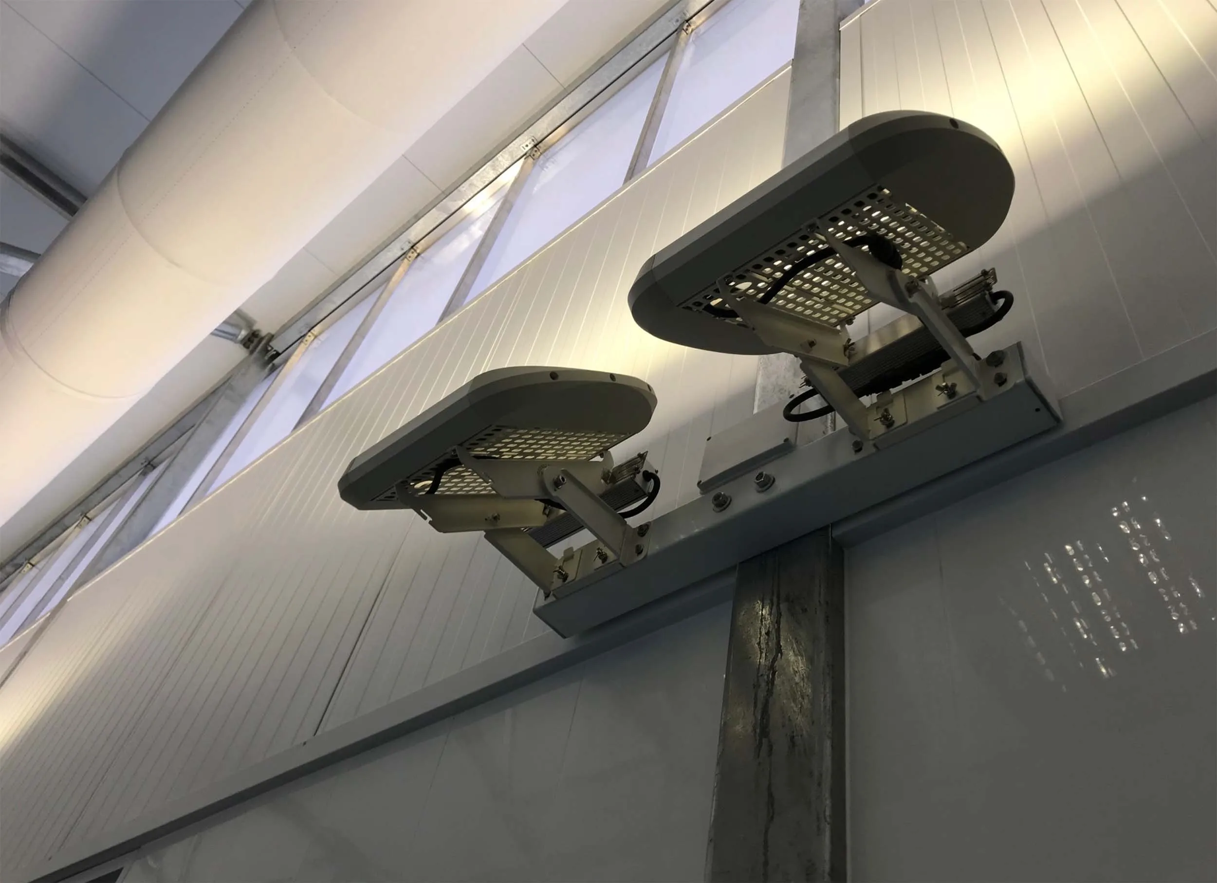Andromeda ceramic flood luminaires mounted beneath a canopy